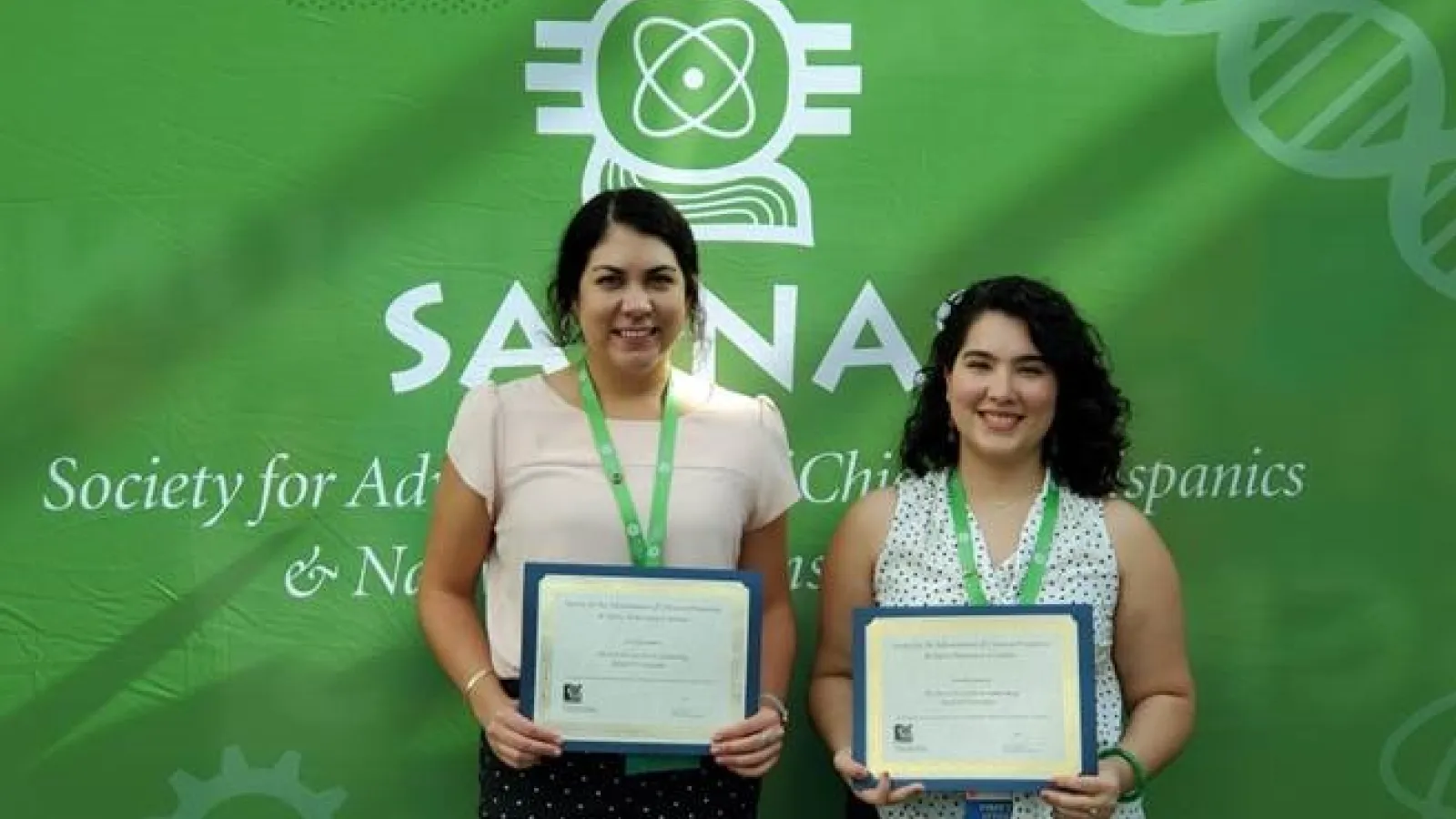 Picture of Ally Langley (left) after receiving her SACNAS Conference presentation award. Ally is pictured with fellow presentation award winner Regina Trevino (right), a Chemistry PhD student in the lab of MBTP Trainer, Dr. Hannah Shafaat.